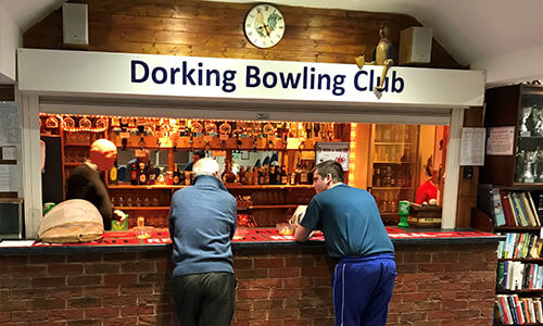 Two men at the bar of Dorking Bowling Club